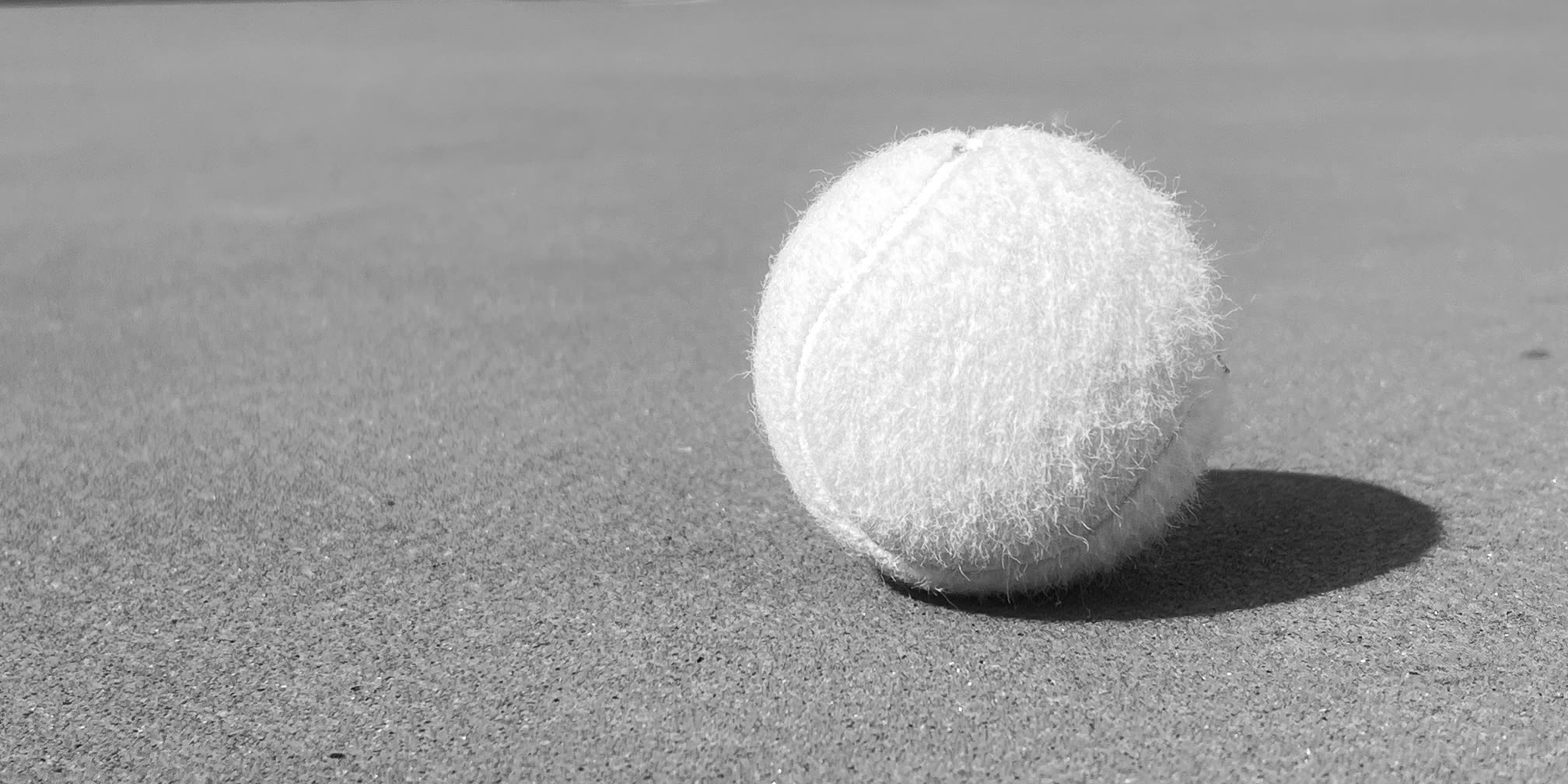 A single ball on the court surface