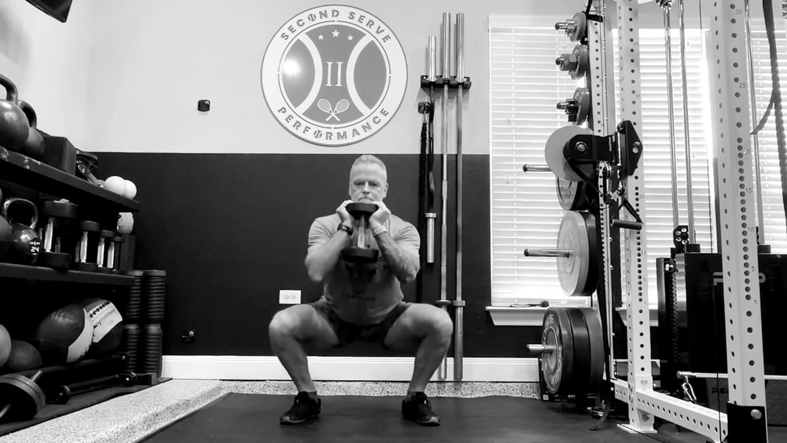 Loaded squat, front on, in the gym